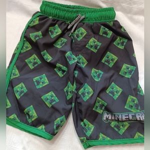 Minecraft brand, boys sz. 6-7, green & black swim trunks.